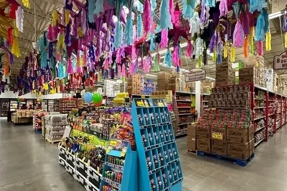 A store filled with lots of colorful items hanging from the ceiling.